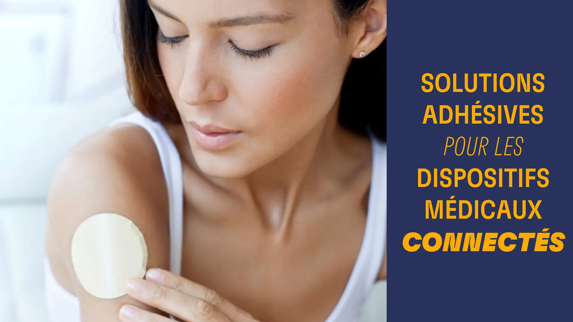 A young woman attaches a smart health patch to her right upper arm.